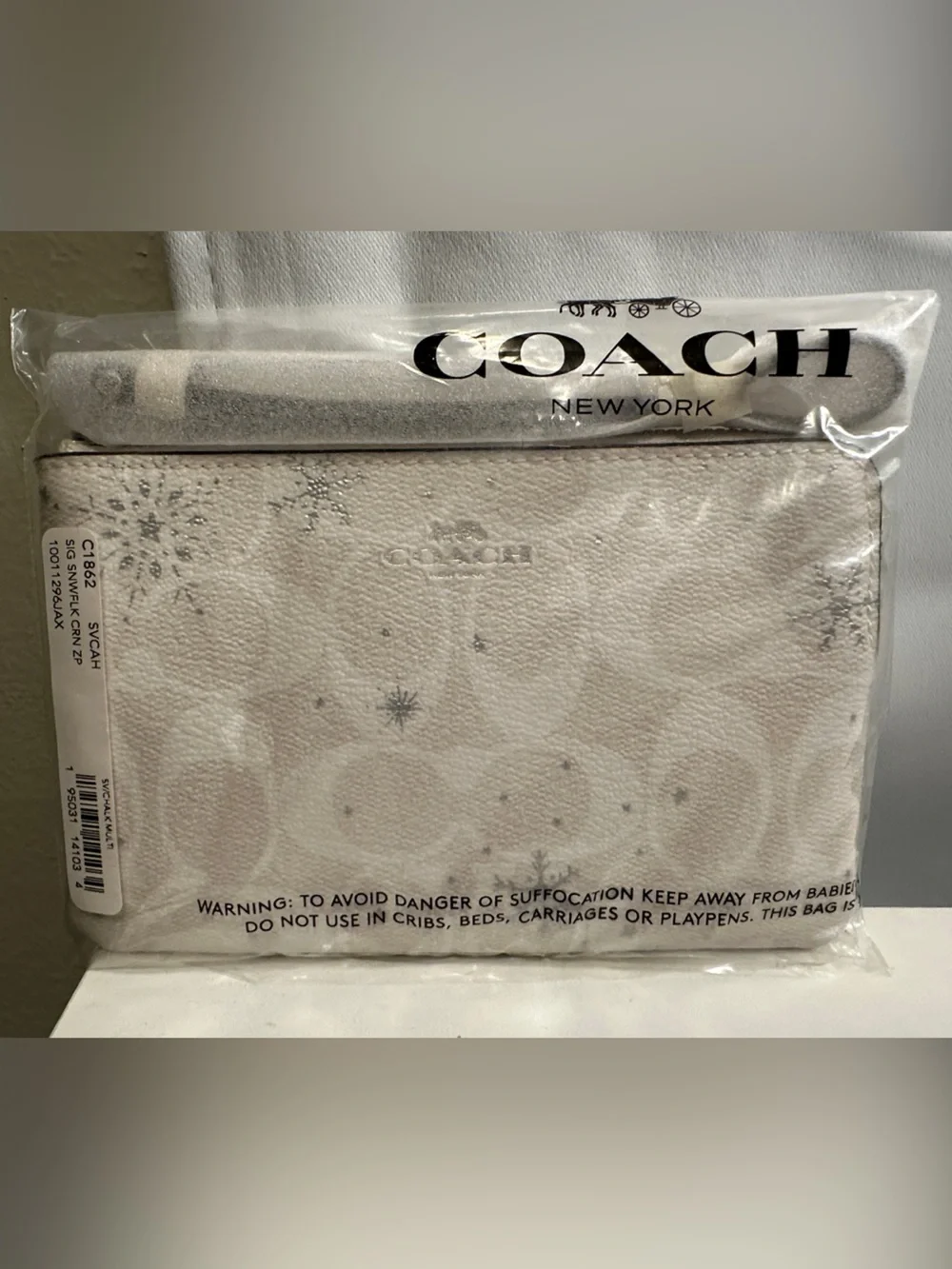 Coach Cream and Silver Snowflake Wristlet Pouch